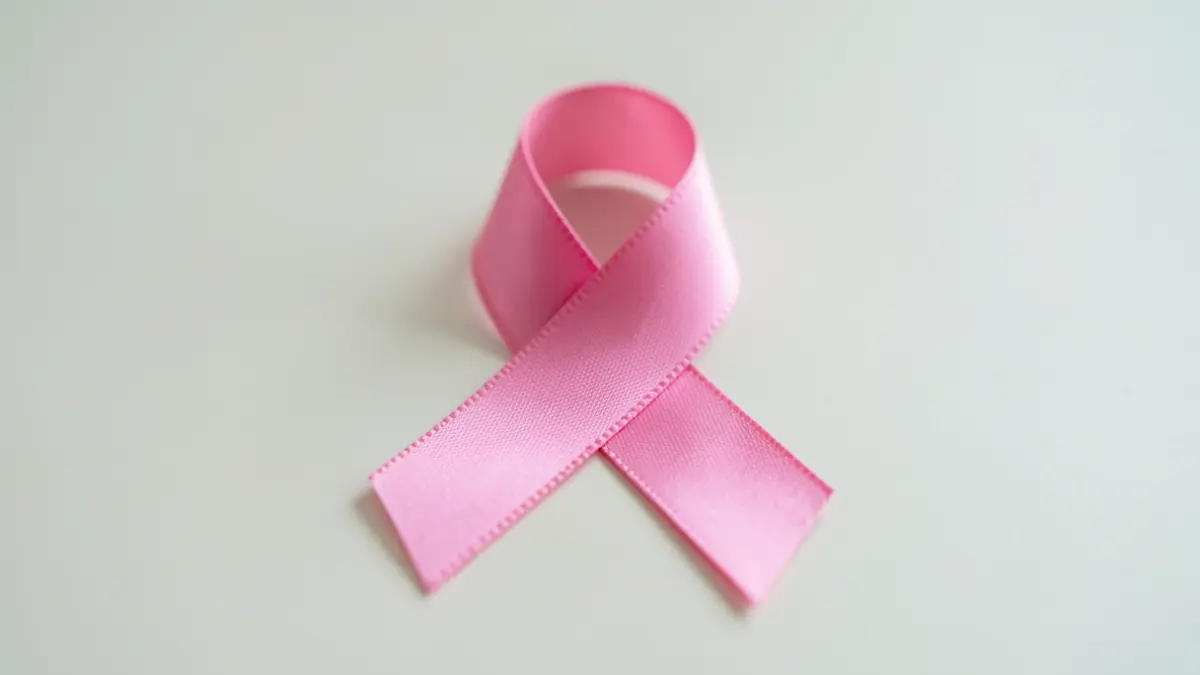 Pink ribbon symbol for breast cancer awareness.